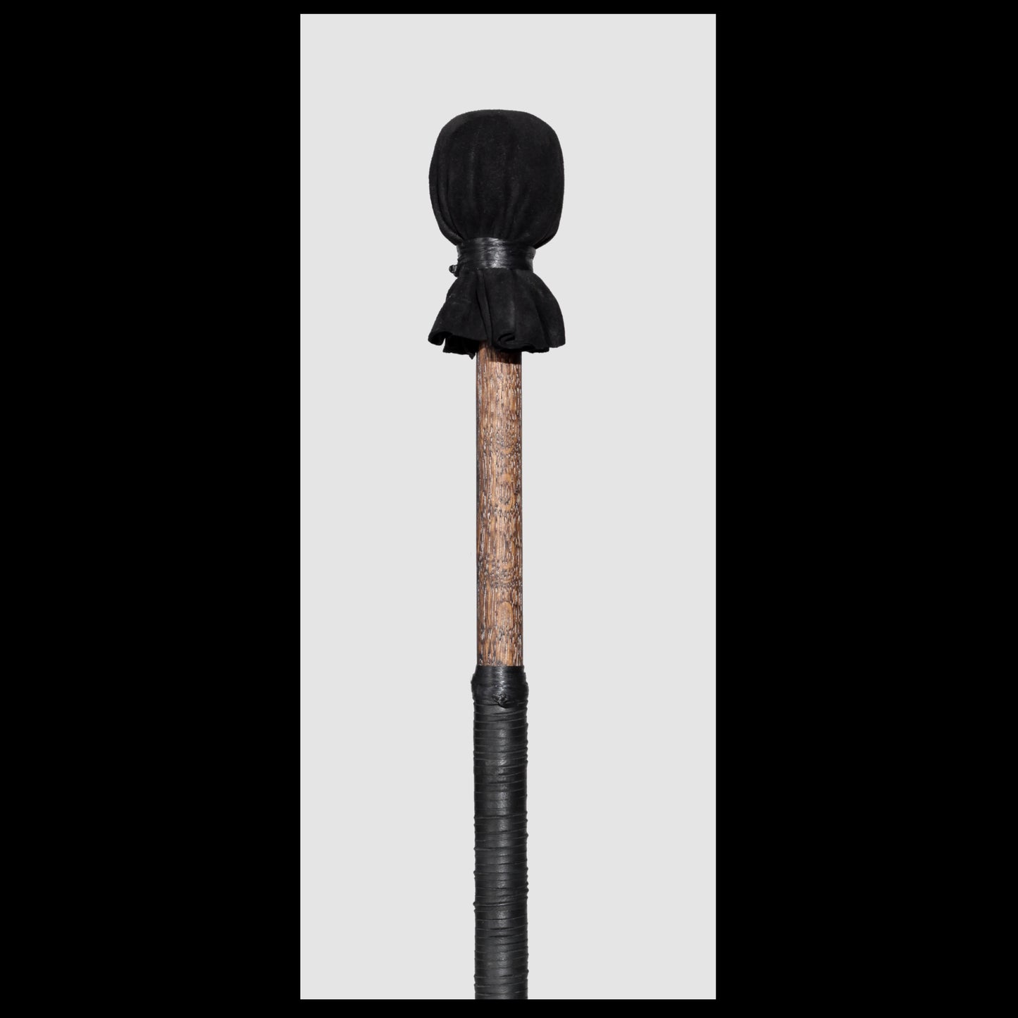 13” medium drum beater, “Black” Goat suede, 5/8” Red Oak handle w/ black Deer leather wrap