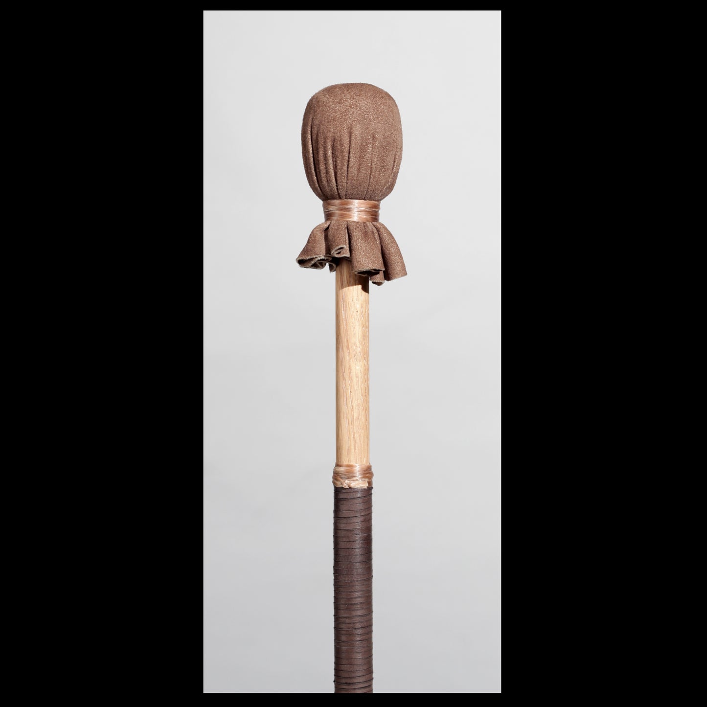 13” medium drum beater, “Earth” Goat suede, 5/8” Red Oak handle w/ brown Deer leather wrap