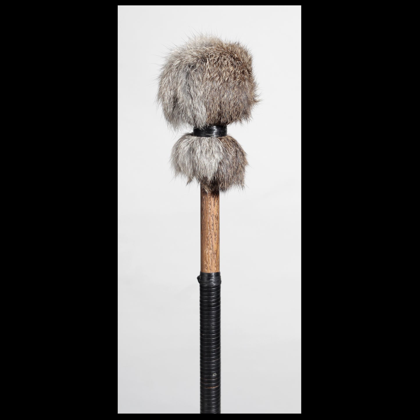 13” Soft drum beater, grey Rabbit fur, 5/8” Red Oak handle w/ black Calf leather wrap