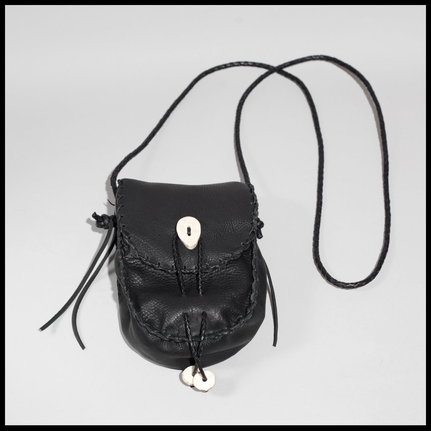 Hand-stitched leather shoulder pouch w/ Deer antler toggles & closure