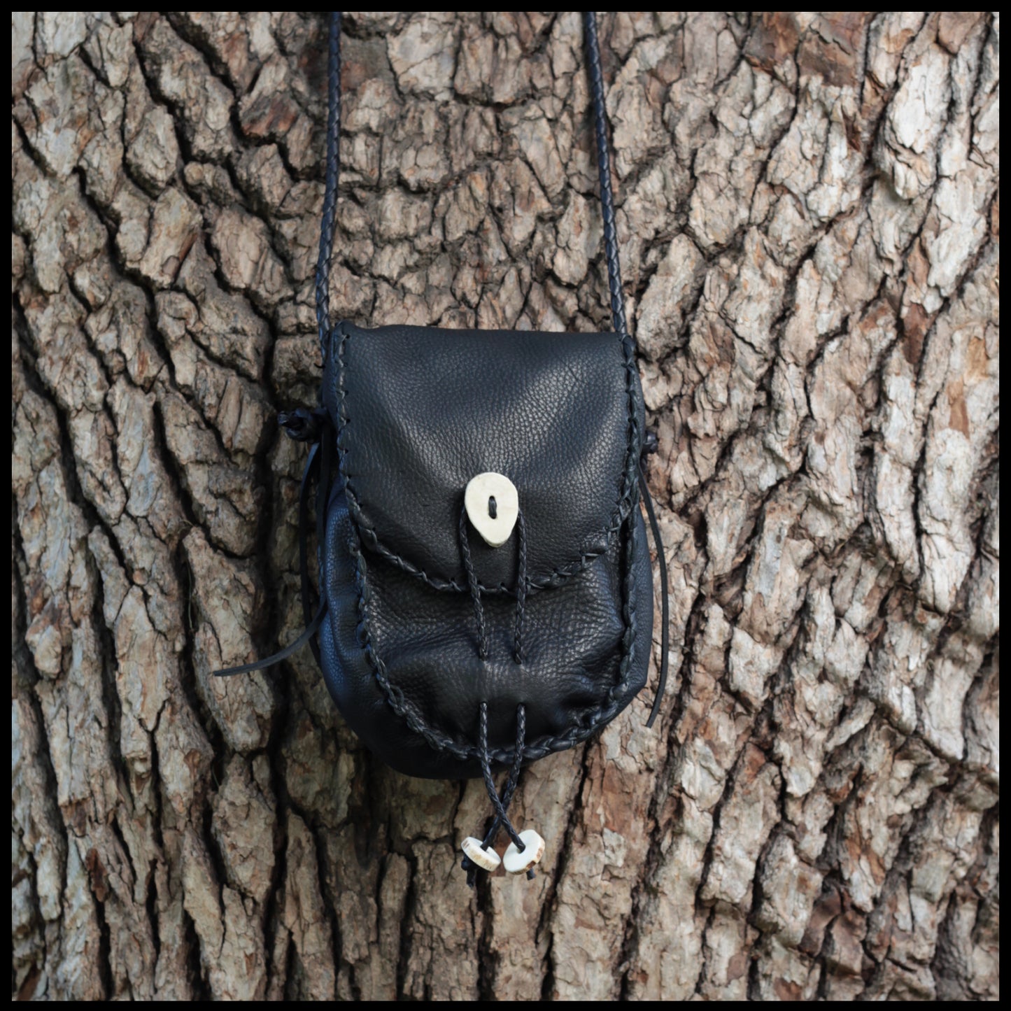 Hand-stitched leather shoulder pouch w/ Deer antler toggles & closure