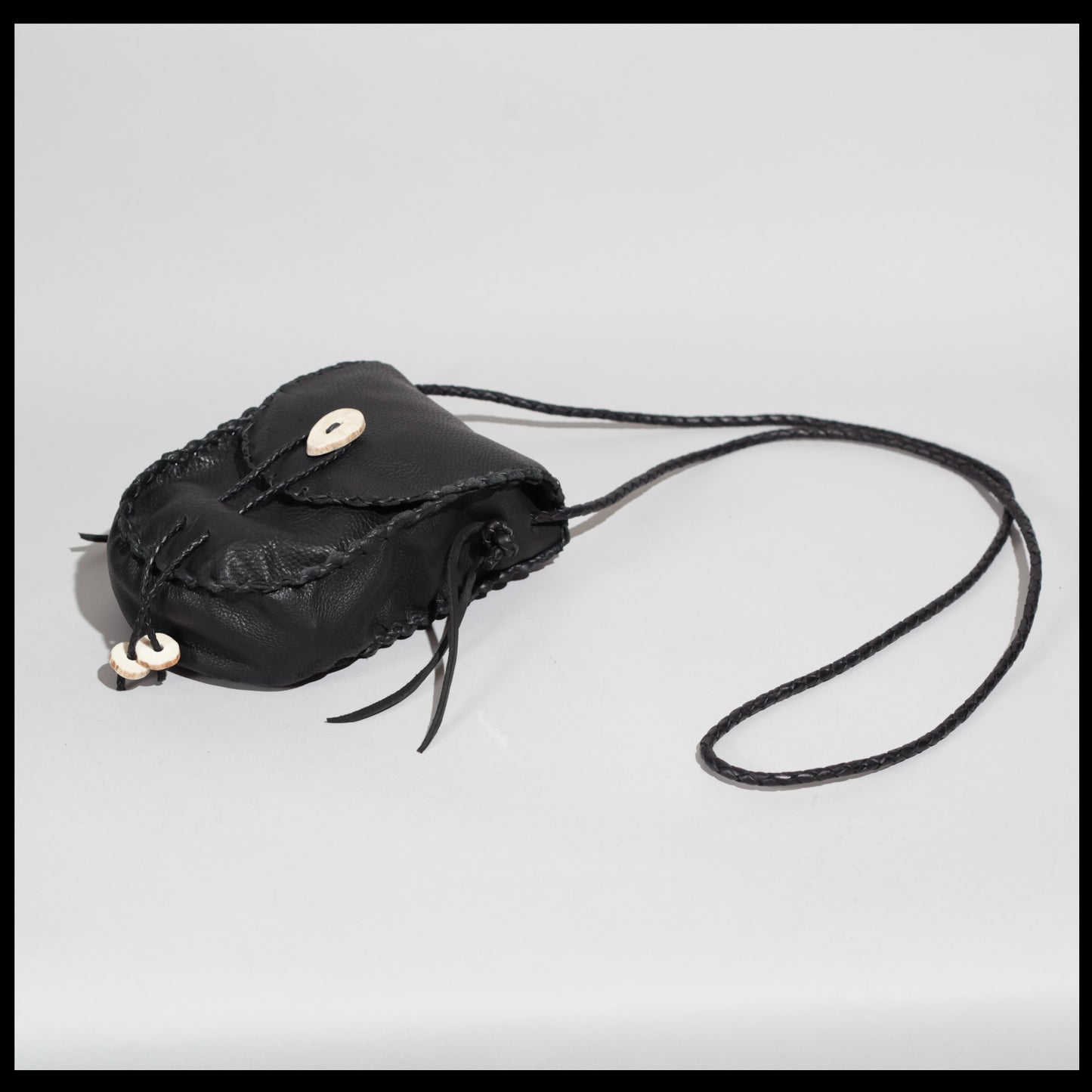 Hand-stitched leather shoulder pouch w/ Deer antler toggles & closure