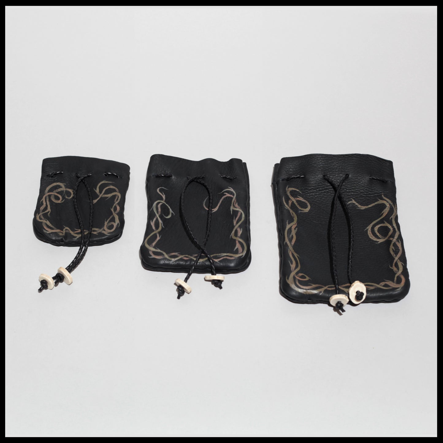 Black "Thorns" hand-painted Deer leather pouch w/ Deer antler toggles