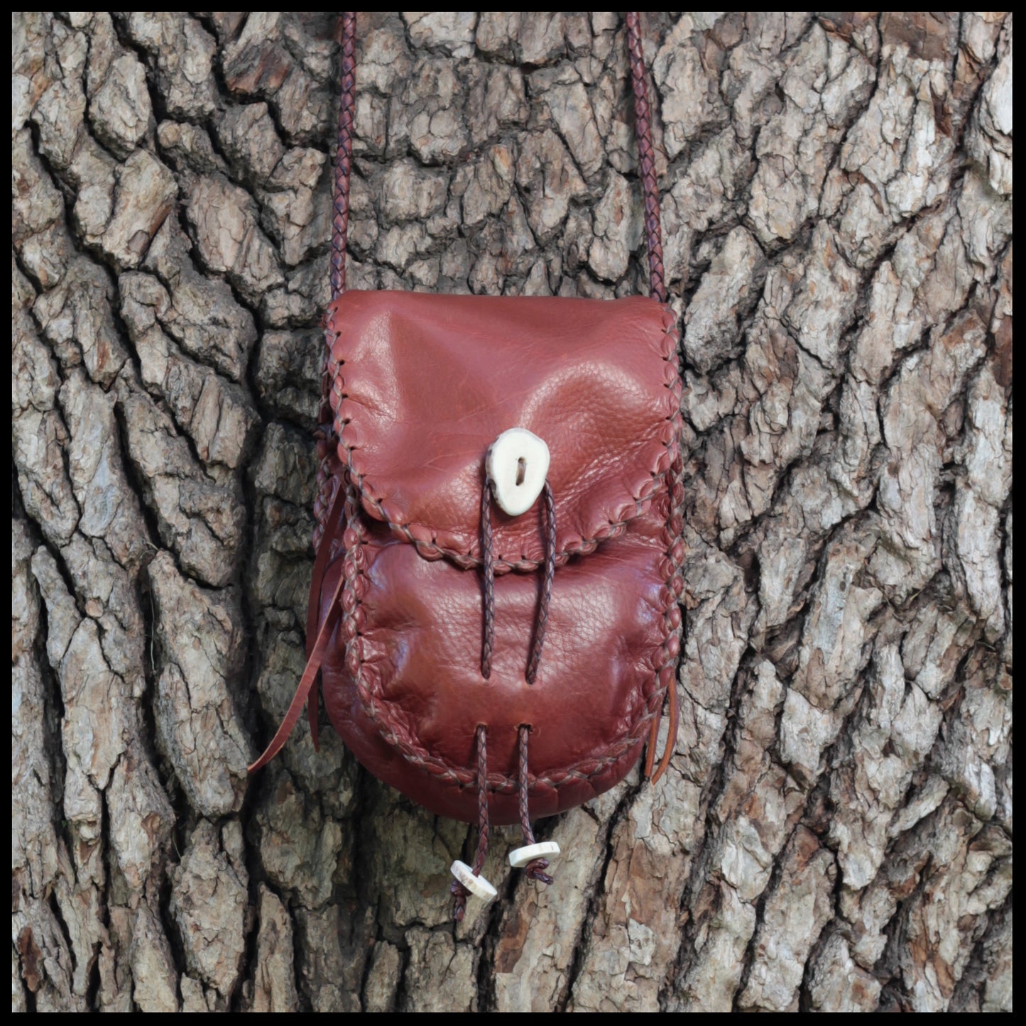 Hand-stitched leather shoulder pouch w/ Deer antler toggles & closure