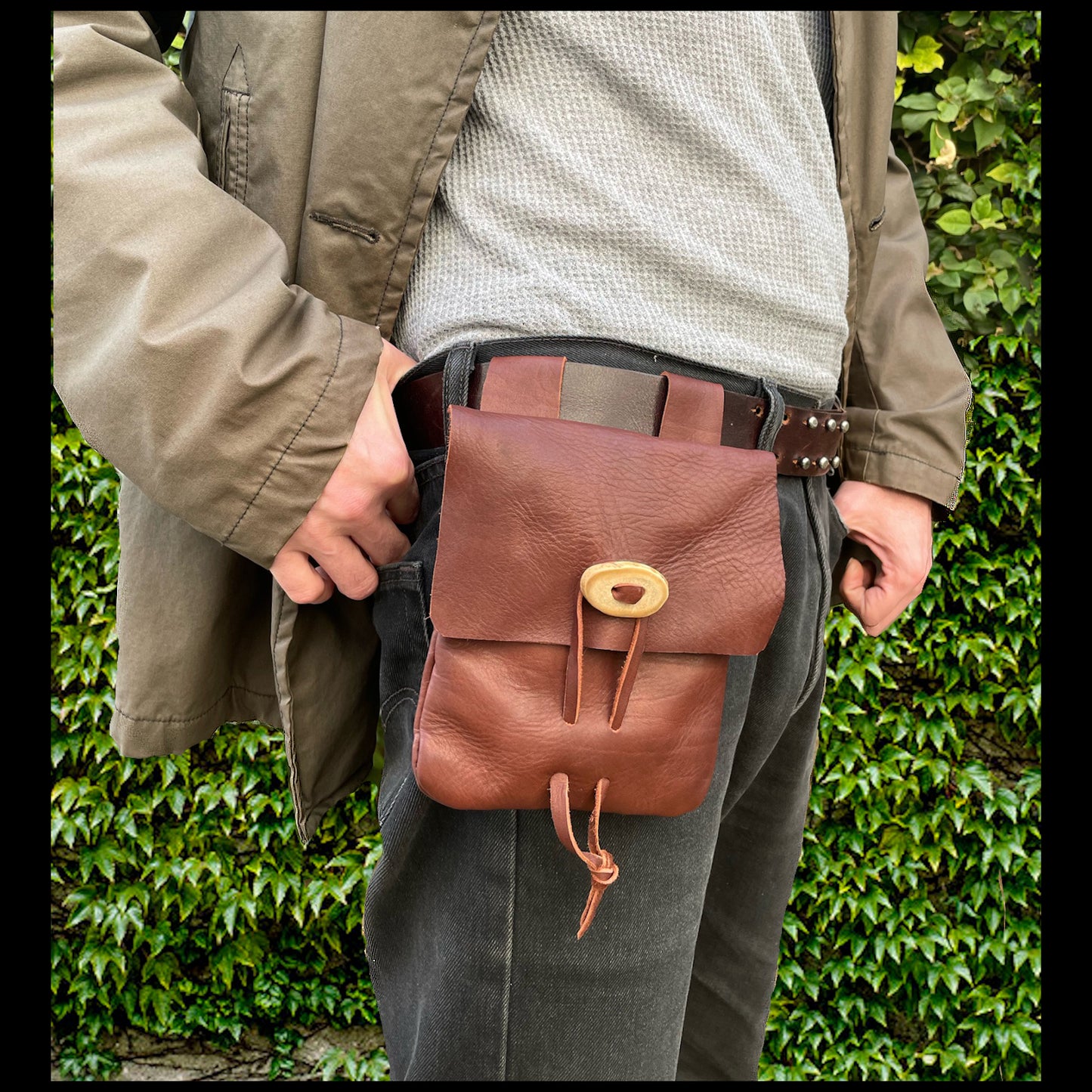 Brown hand-stitched leather belt pouch w/ Deer antler closure