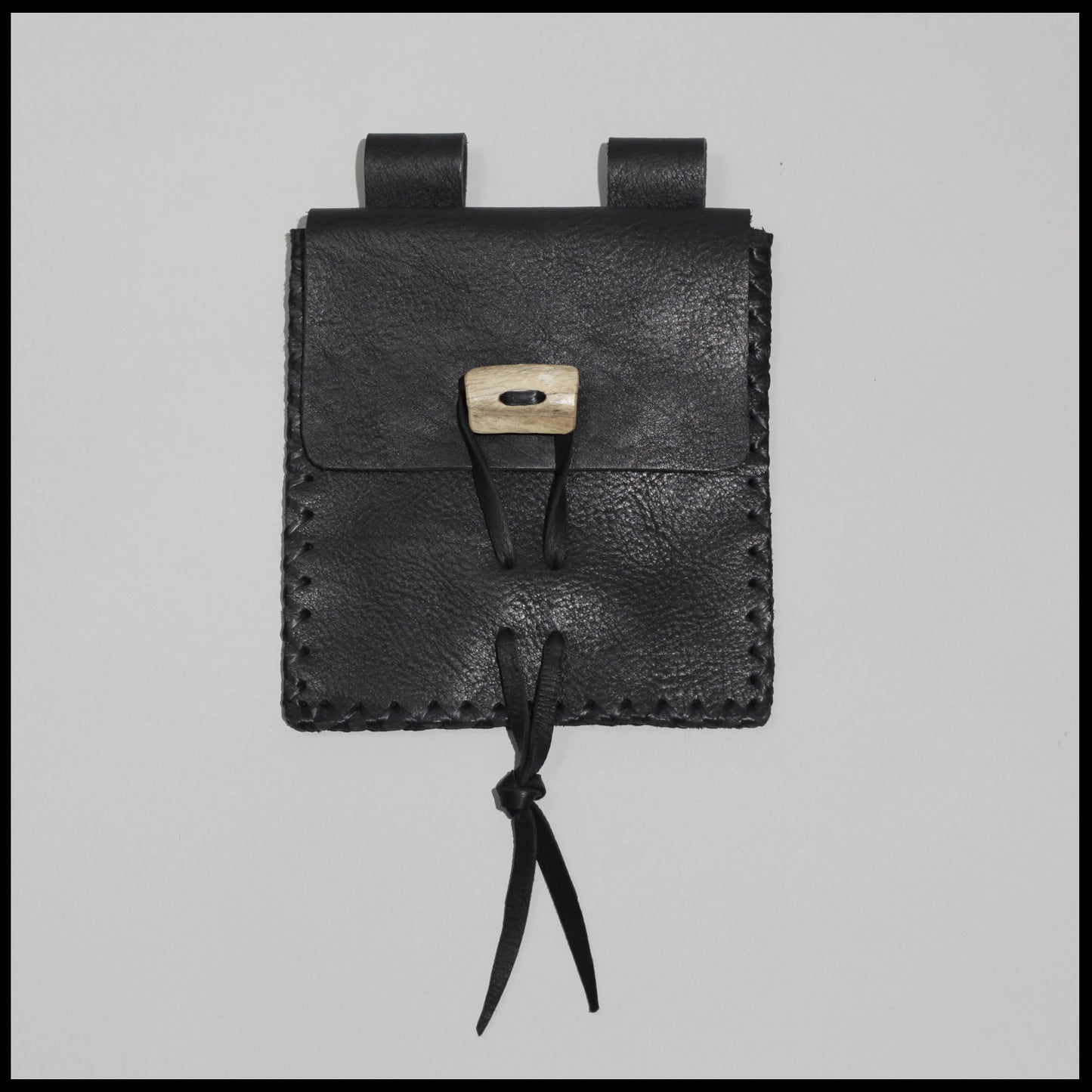 Black hand-stitched leather belt pouch w/ Elk rib closure