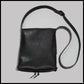 Black hand-stitched leather shoulder bag w/ hand-carved Deer antler Sun Wheel closure