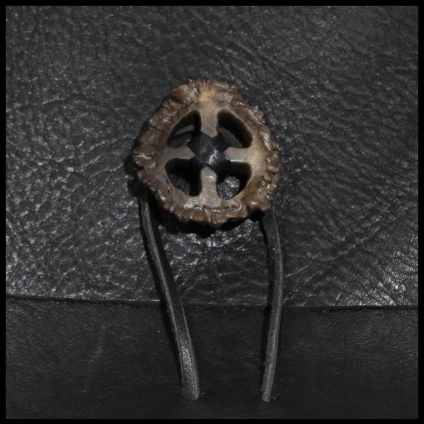 Black hand-stitched leather shoulder bag w/ hand-carved Deer antler Sun Wheel closure