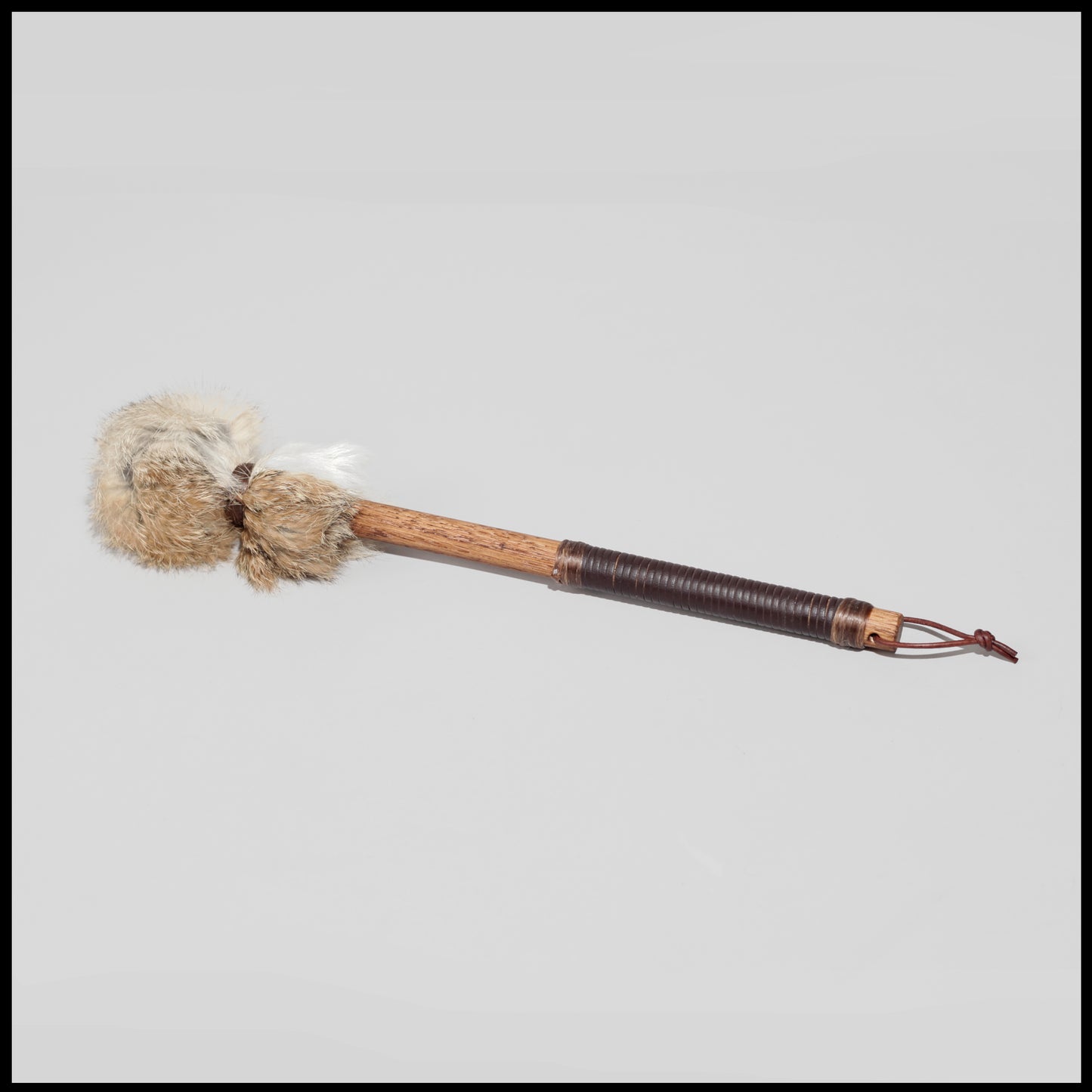 13” Soft drum beater, tan & white Rabbit fur, 5/8” Red Oak handle w/ brown leather wrap