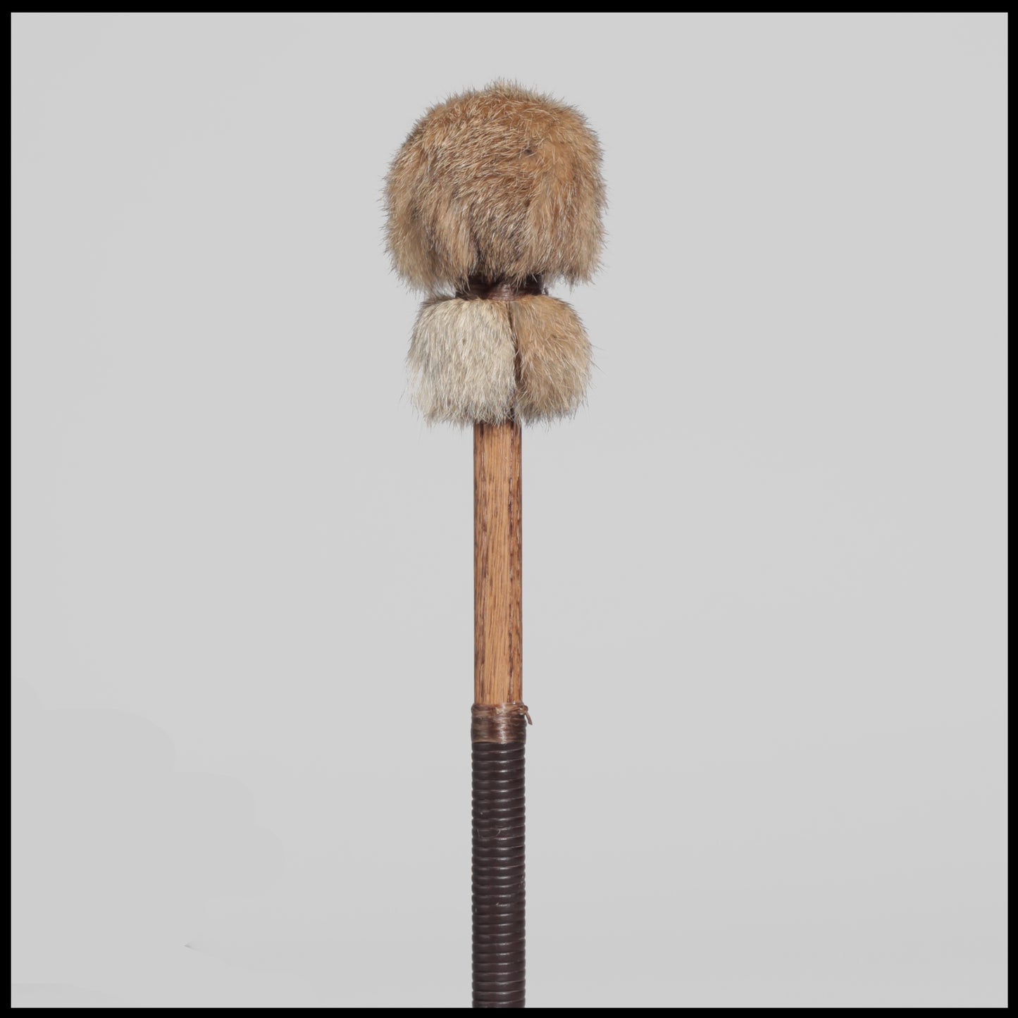 13” Soft drum beater, tan Rabbit fur, 5/8” Red Oak handle w/ brown leather wrap