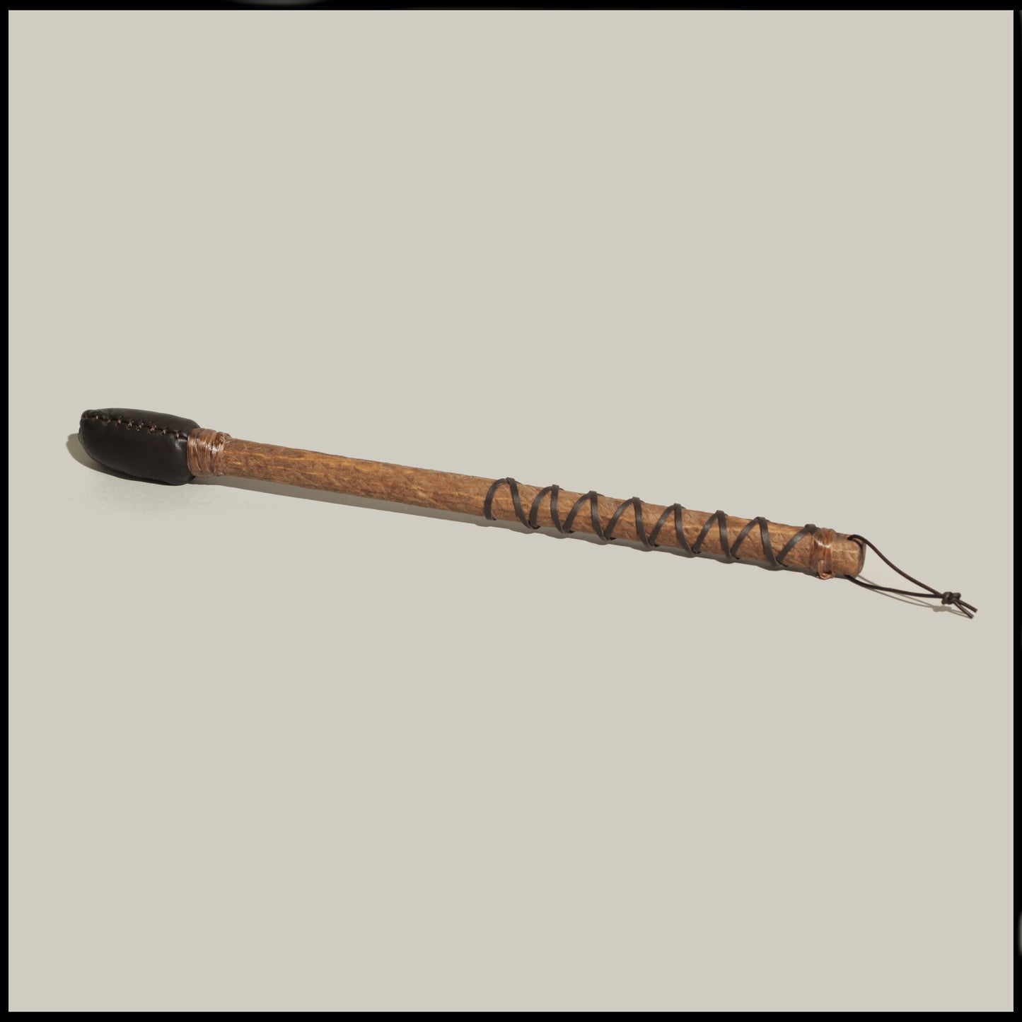 16” Hard drum beater, 3/4" Poplar handle, hand-sewn brown Deer leather head w/ brown leather braid